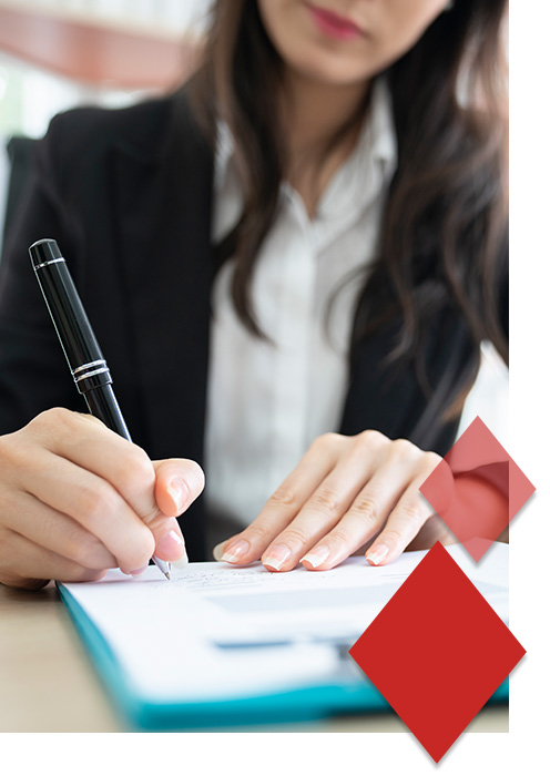 Img3 Woman writing on a business document
