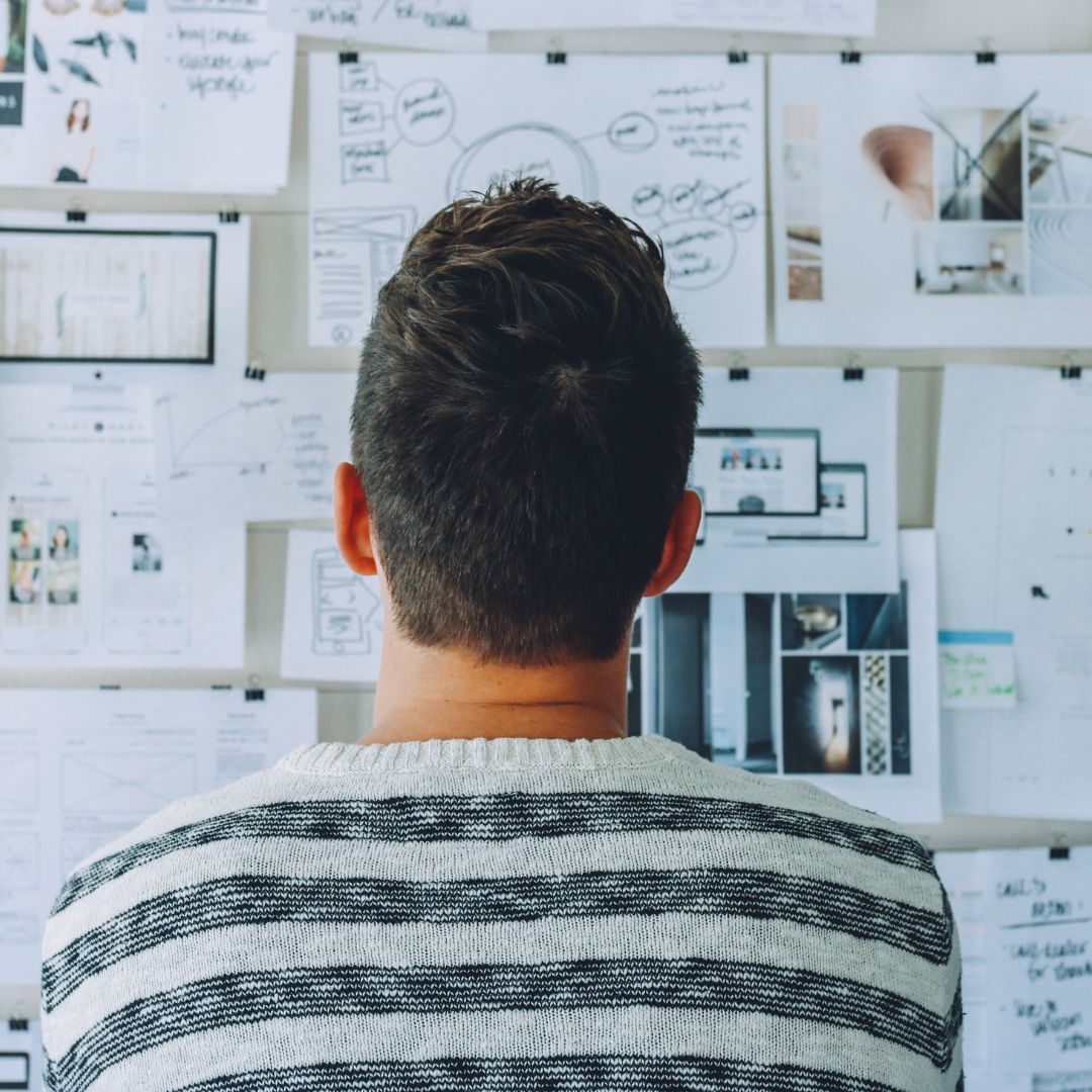 a person looking at a wall of information