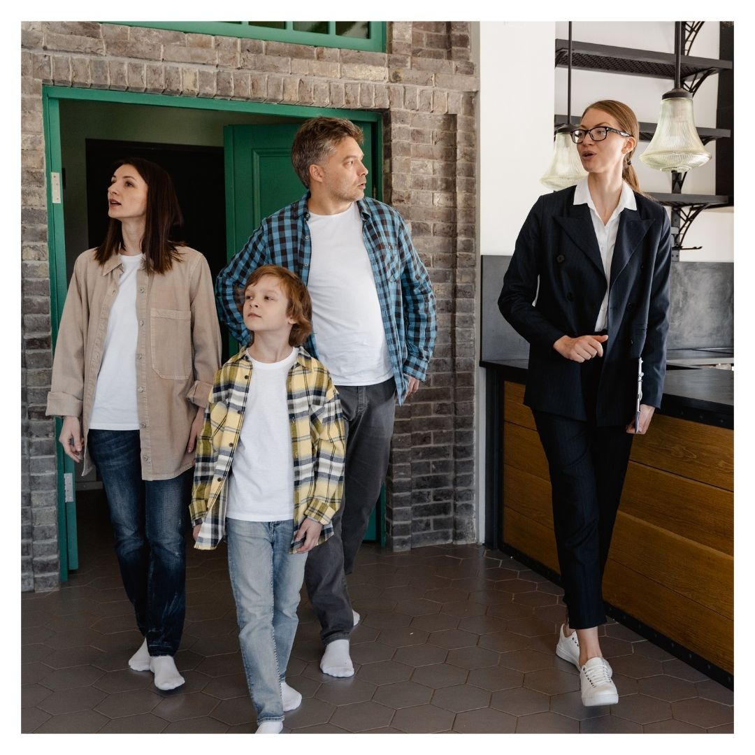 Family touring rental property with leasing specialist
