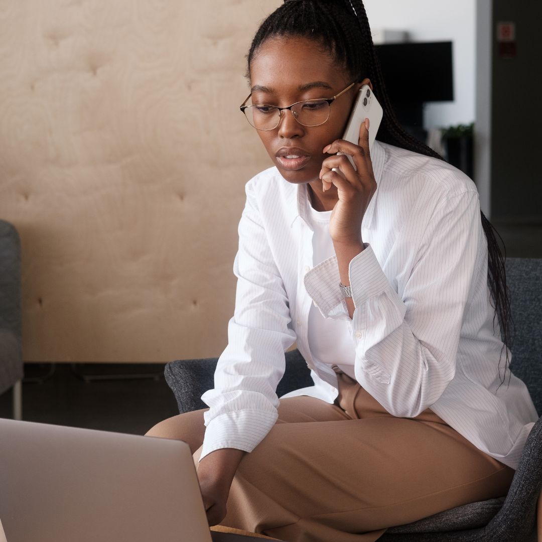Woman in business clothes having a phone call